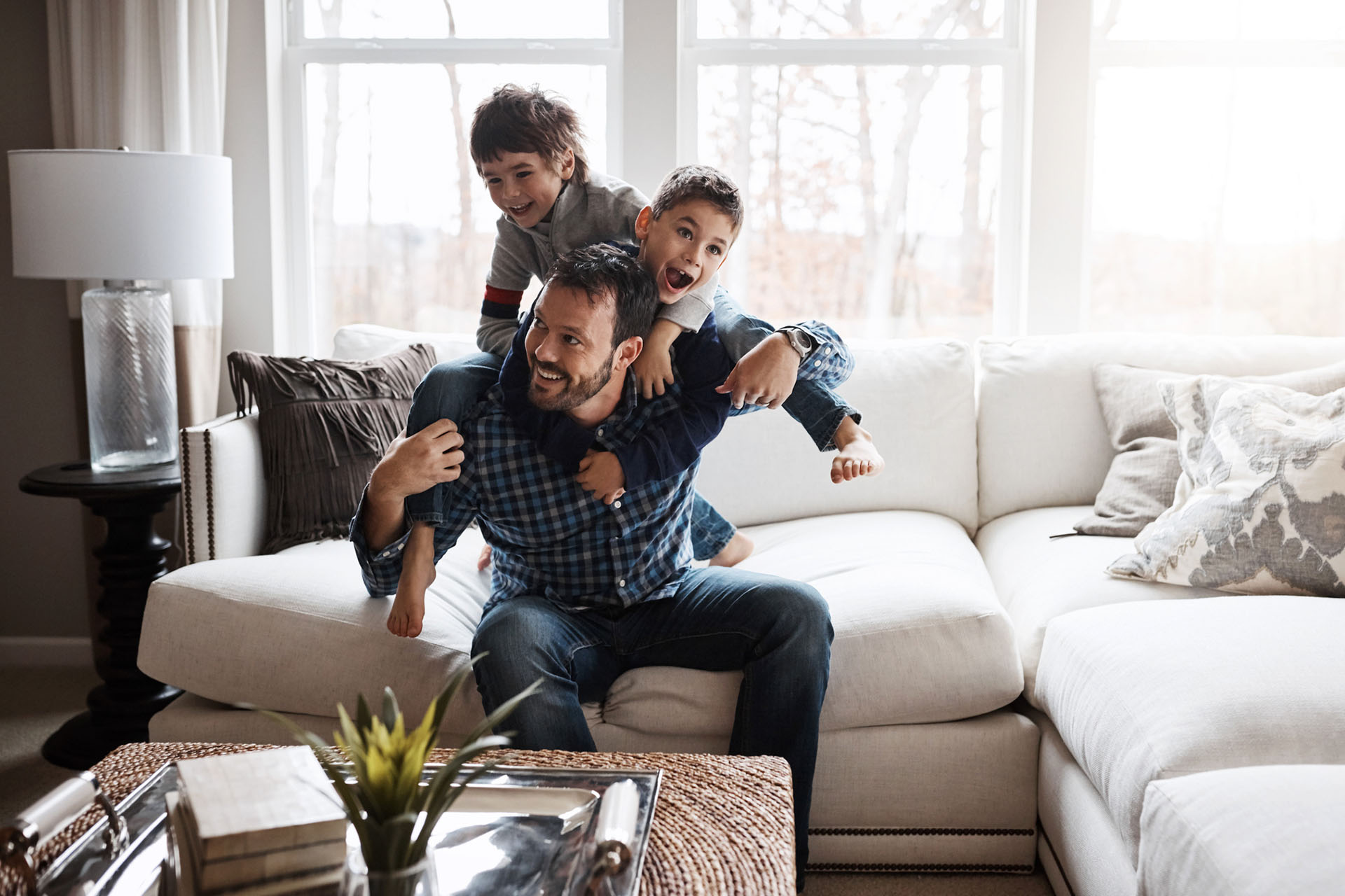 father playing with his two sons