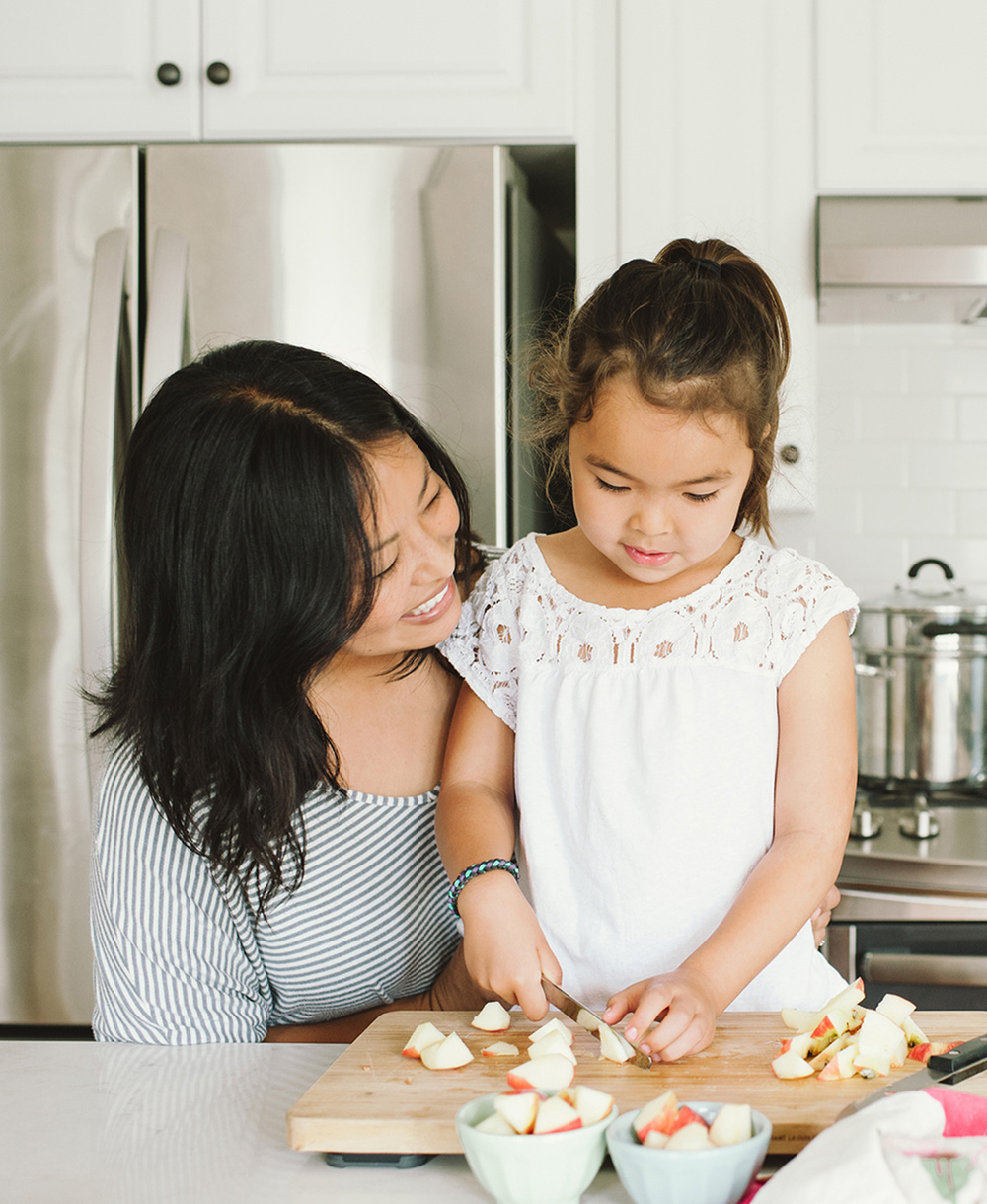 mother and daughter baking together