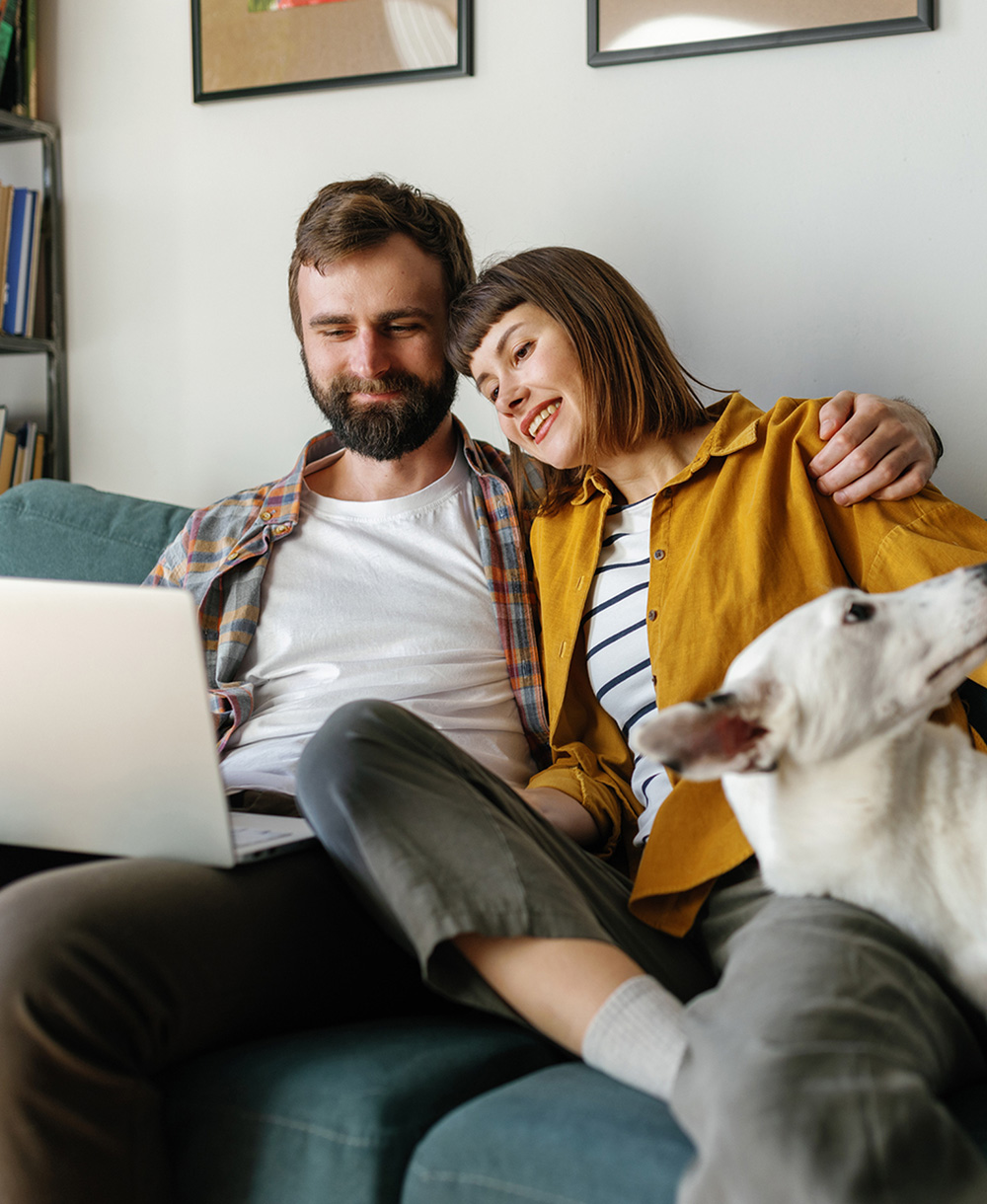 couple watching something on a laptop