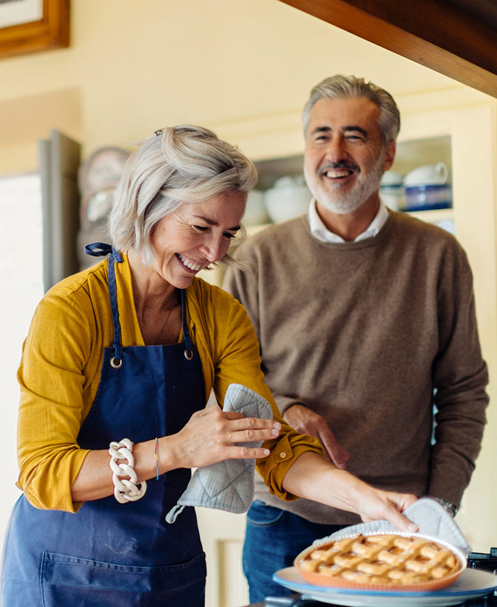 older couple baking together